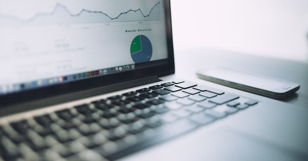 Analyst reviewing a business dashboard on a large screen