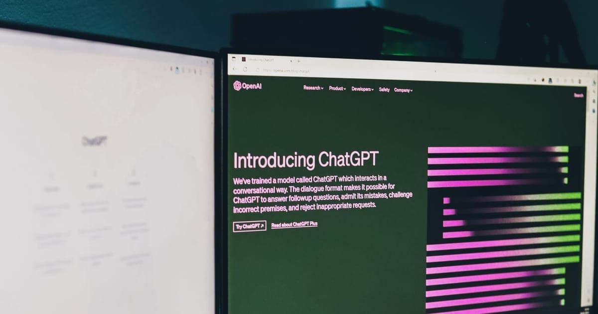 ChatGPT open across two monitors in a dark workspace
